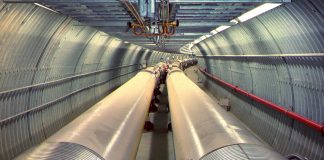 The Relativistic Heavy Ion Collider (RHIC) consists of twin rings of superconducting magnets carrying ions (atomic nuclei stripped of their electrons) in opposite directions (see particles collide). The Electron-Ion Collider (EIC) will reuse one of these ion storage rings and add an electron accelerator, an electron storage ring, and other accelerator infrastructure to collide electrons with protons or ions. (Brookhaven National Laboratory)